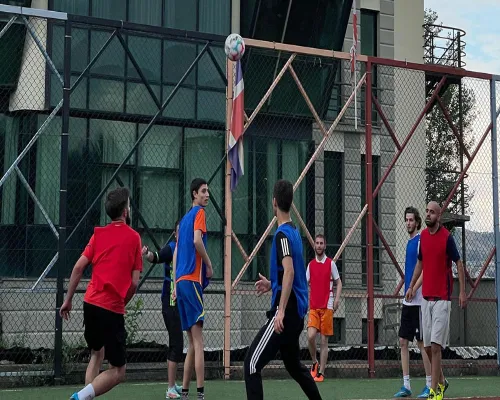 a group of people playing football at Grigol Robakidze University Georgia students playing